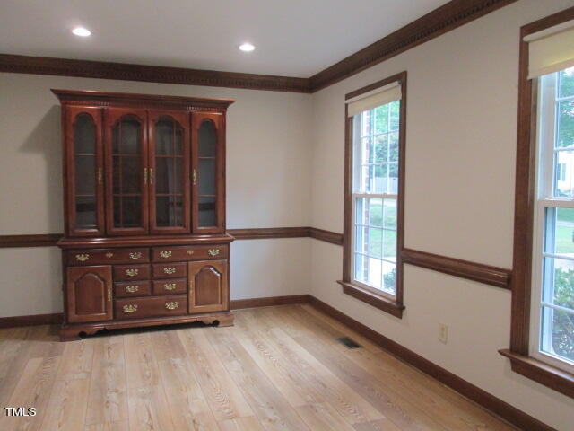 200 Raindrop Court Raleigh, NC 27615 - Photo 17 of 61 wooden floor in an empty room with a window