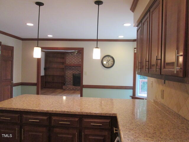 200 Raindrop Court Raleigh, NC 27615 - Photo 26 of 61 a kitchen with a sink a counter space and cabinets