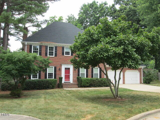 200 Raindrop Court Raleigh, NC 27615 - Photo 3 of 61 a front view of a house with a yard