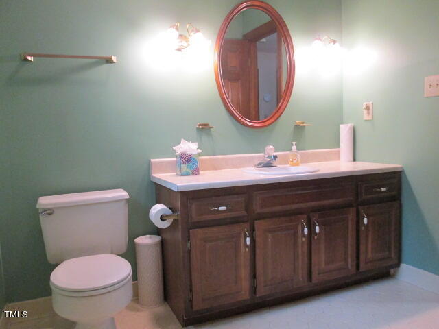 200 Raindrop Court Raleigh, NC 27615 - Photo 36 of 61 a bathroom with a toilet sink and mirror