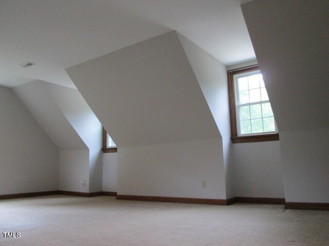 200 Raindrop Court Raleigh, NC 27615 - Photo 42 of 61 a view of an empty room with wooden floor and a window