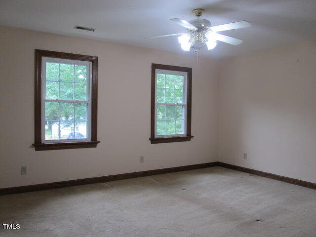 200 Raindrop Court Raleigh, NC 27615 - Photo 49 of 61 an empty room with a window and a fan