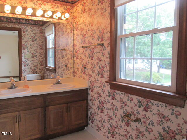 200 Raindrop Court Raleigh, NC 27615 - Photo 51 of 61 a bathroom with a sink and a mirror
