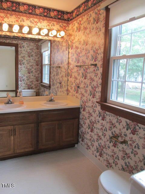 200 Raindrop Court Raleigh, NC 27615 - Photo 52 of 61 a bathroom with a sink and a toilet
