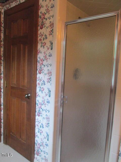 200 Raindrop Court Raleigh, NC 27615 - Photo 53 of 61 a bathroom with a glass door shower