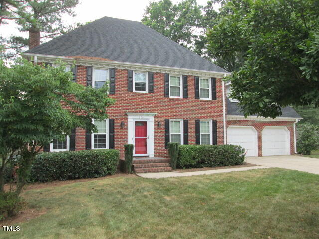 200 Raindrop Court Raleigh, NC 27615 - Photo 57 of 61 a front view of a house with a garden