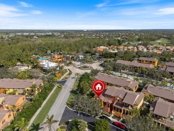 an aerial view of a house with swimming pool