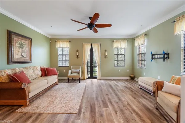 a living room with furniture and a large window