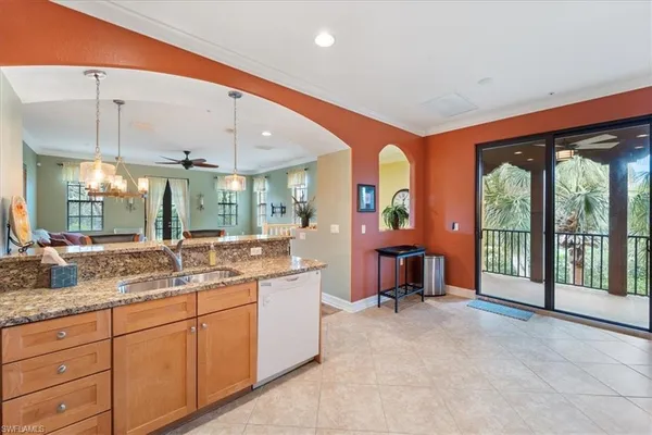 a view of a hallway with furniture and entryway