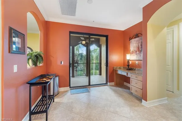 a view of a porch with a floor to ceiling window and outside view