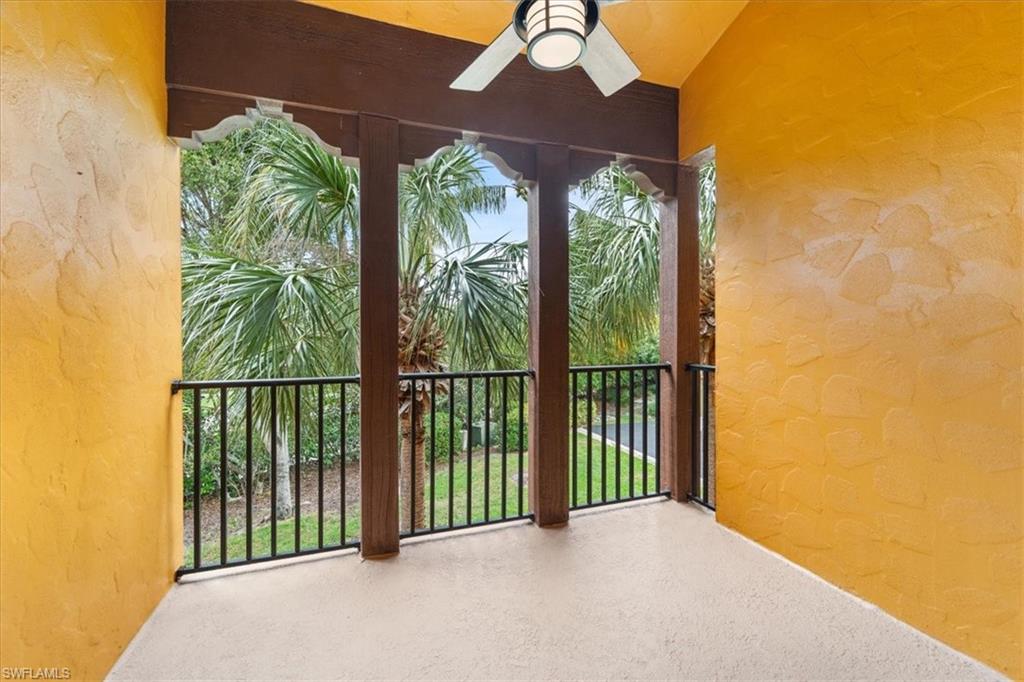 9091 Covina Drive South, Unit 6904 Naples, FL 34113 - Photo 20 of 46 a view of a porch with a floor to ceiling window and outside view