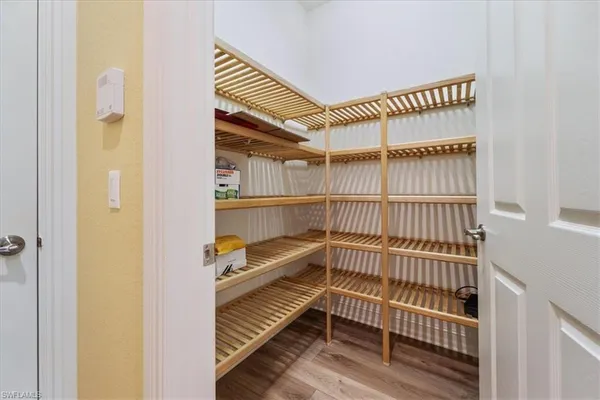 a view of a livingroom with furniture and staircase