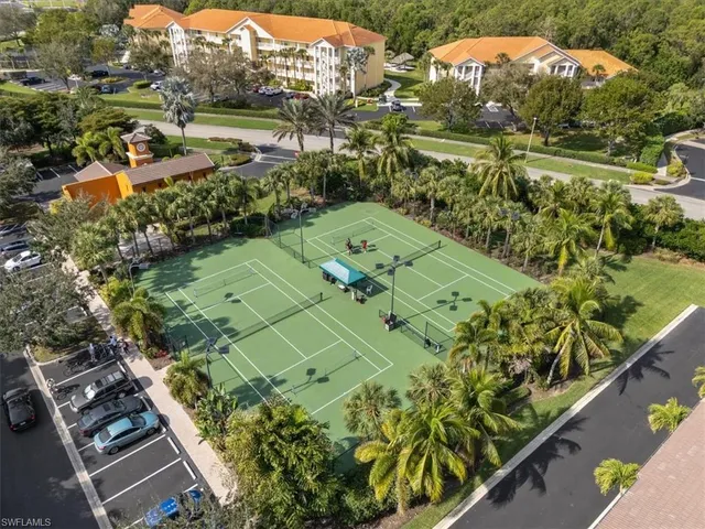 a view of backyard with swimming pool and outdoor seating