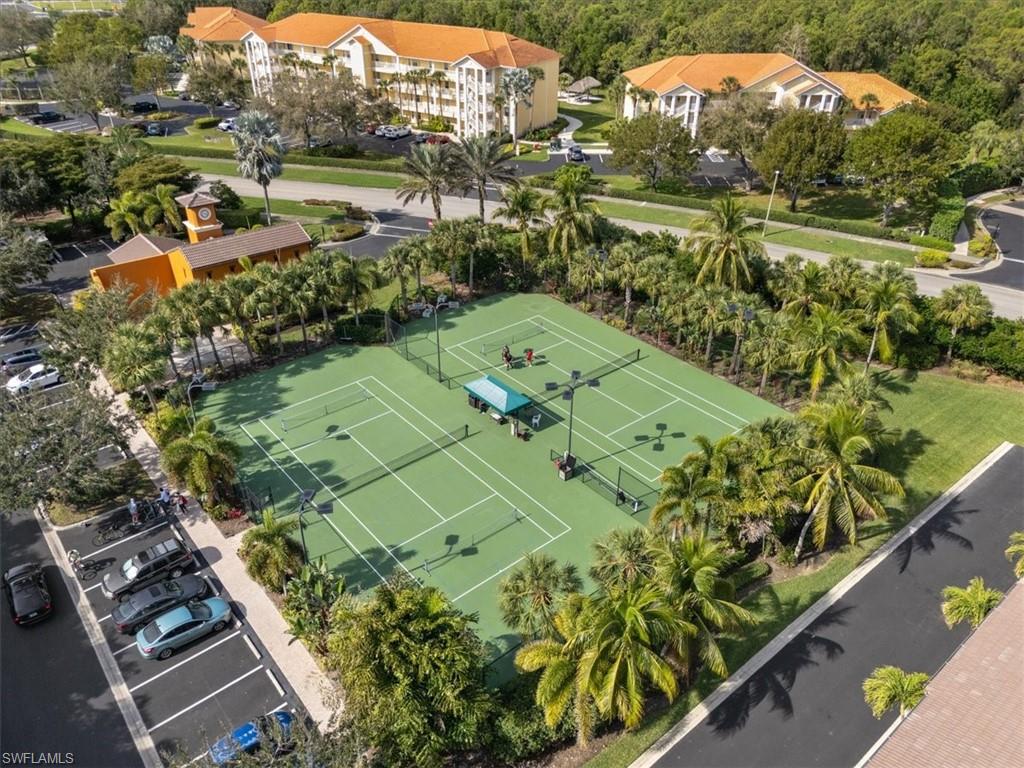 9091 Covina Drive South, Unit 6904 Naples, FL 34113 - Photo 43 of 46 an aerial view of a residential houses with outdoor space and street view