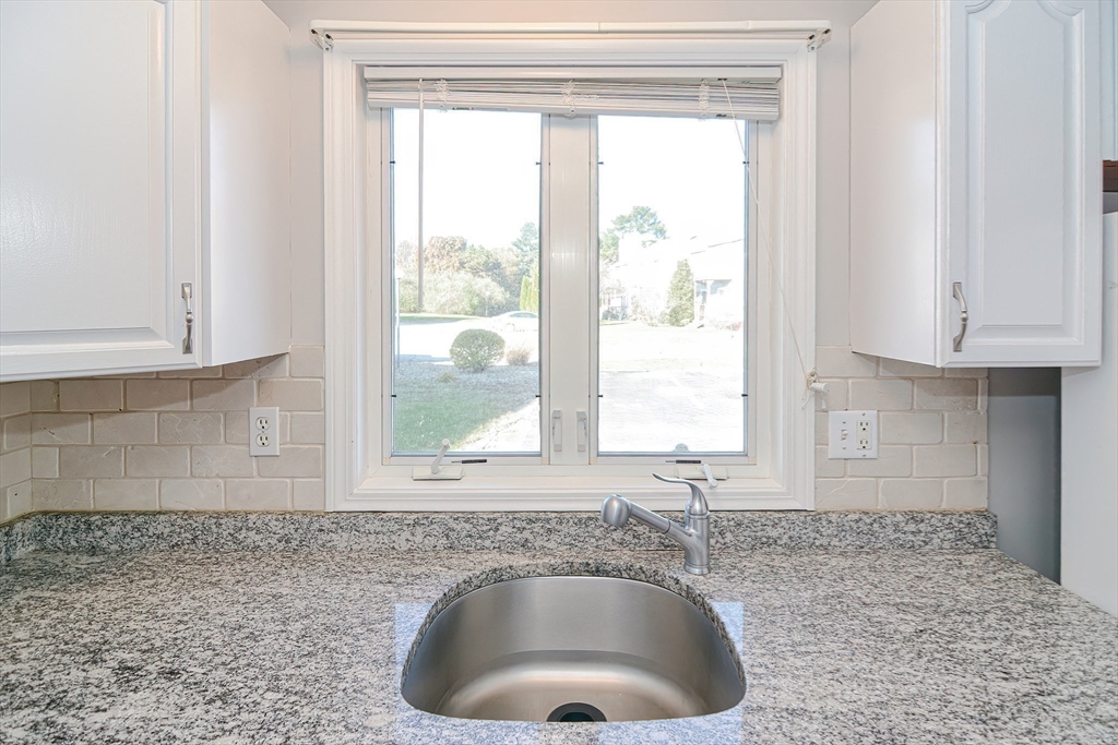 2743 Cranberry Highway, Unit 2D Wareham, MA 02571 - Photo 12 of 37 a bathroom with a granite countertop sink and window
