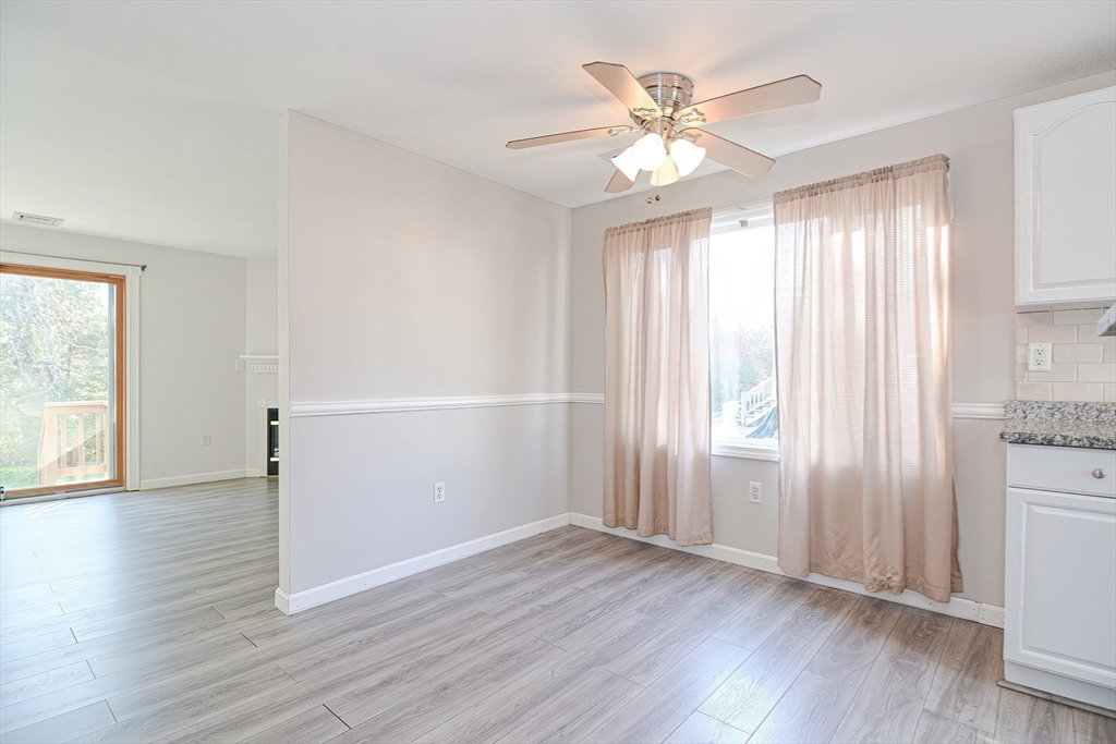 2743 Cranberry Highway, Unit 2D Wareham, MA 02571 - Photo 16 of 37 an empty room with wooden floor fan and windows