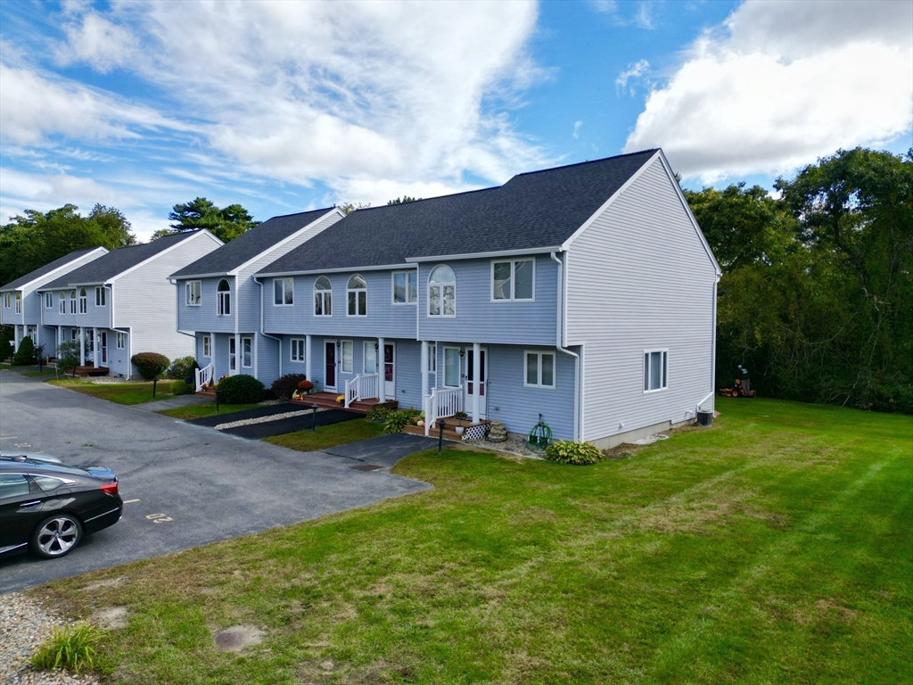 2743 Cranberry Highway, Unit 2D Wareham, MA 02571 - Photo 2 of 37 a view of a house with a yard and sitting area