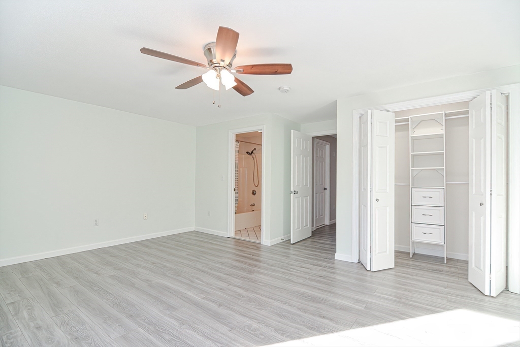2743 Cranberry Highway, Unit 2D Wareham, MA 02571 - Photo 23 of 37 an empty room with wooden floor closet and windows