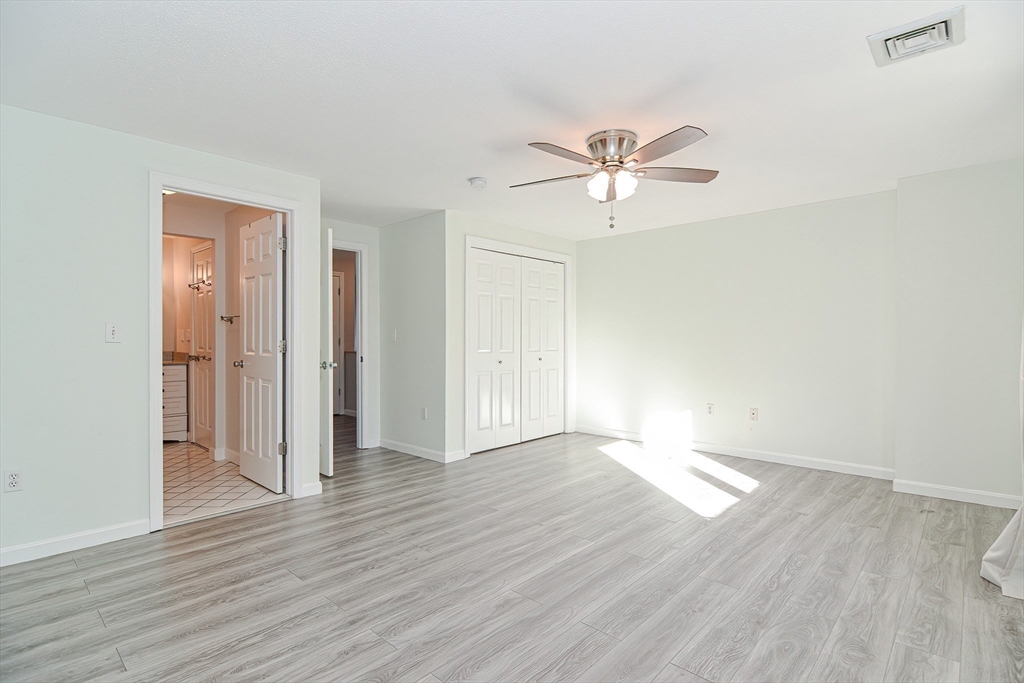 2743 Cranberry Highway, Unit 2D Wareham, MA 02571 - Photo 25 of 37 a view of an empty room with wooden floor