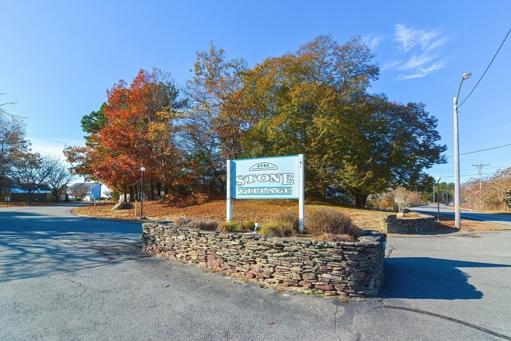 2743 Cranberry Highway, Unit 2D Wareham, MA 02571 - Photo 3 of 37 a view of a street with flower plants next to a road