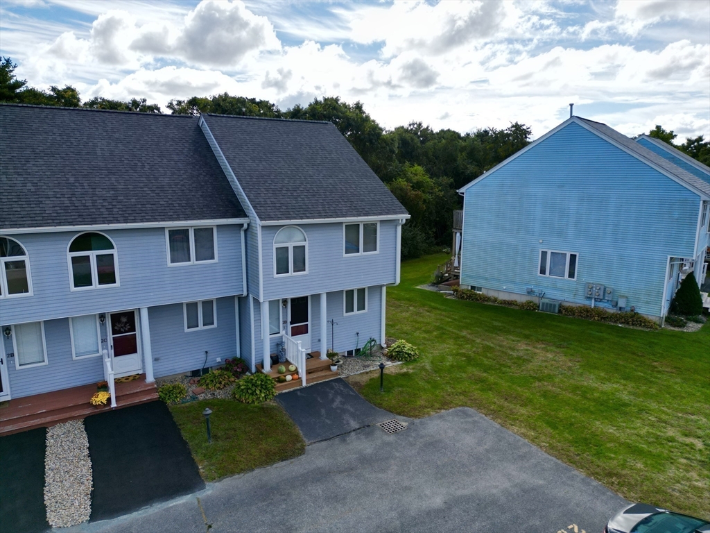 2743 Cranberry Highway, Unit 2D Wareham, MA 02571 - Photo 36 of 37 front view of a house with a yard
