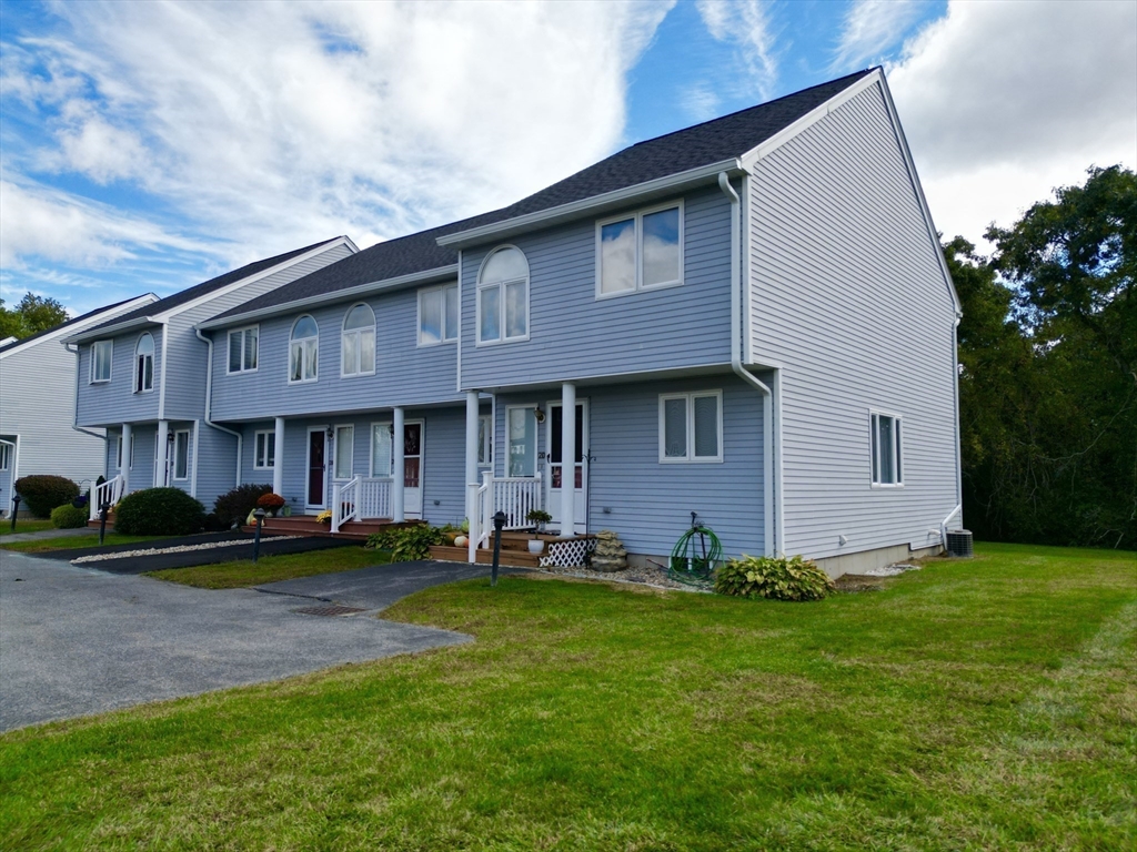 2743 Cranberry Highway, Unit 2D Wareham, MA 02571 - Photo 6 of 37 a front view of a house with garden