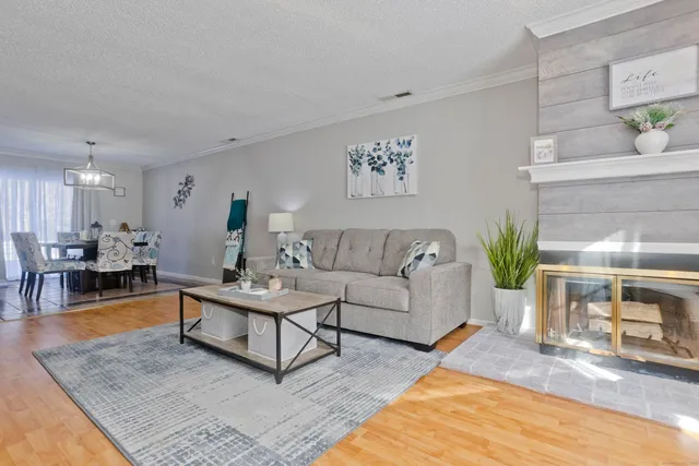 a living room with furniture and a table