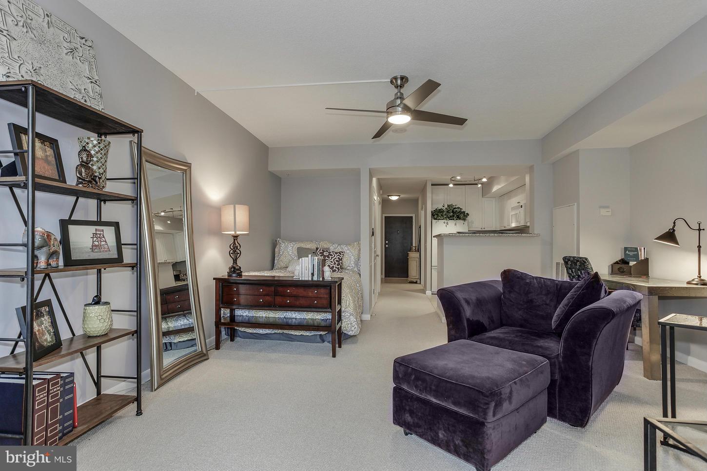 851 North Glebe Road, Unit 1010 Arlington, VA 22203 - Photo 13 of 30 a living room with furniture and a ceiling fan