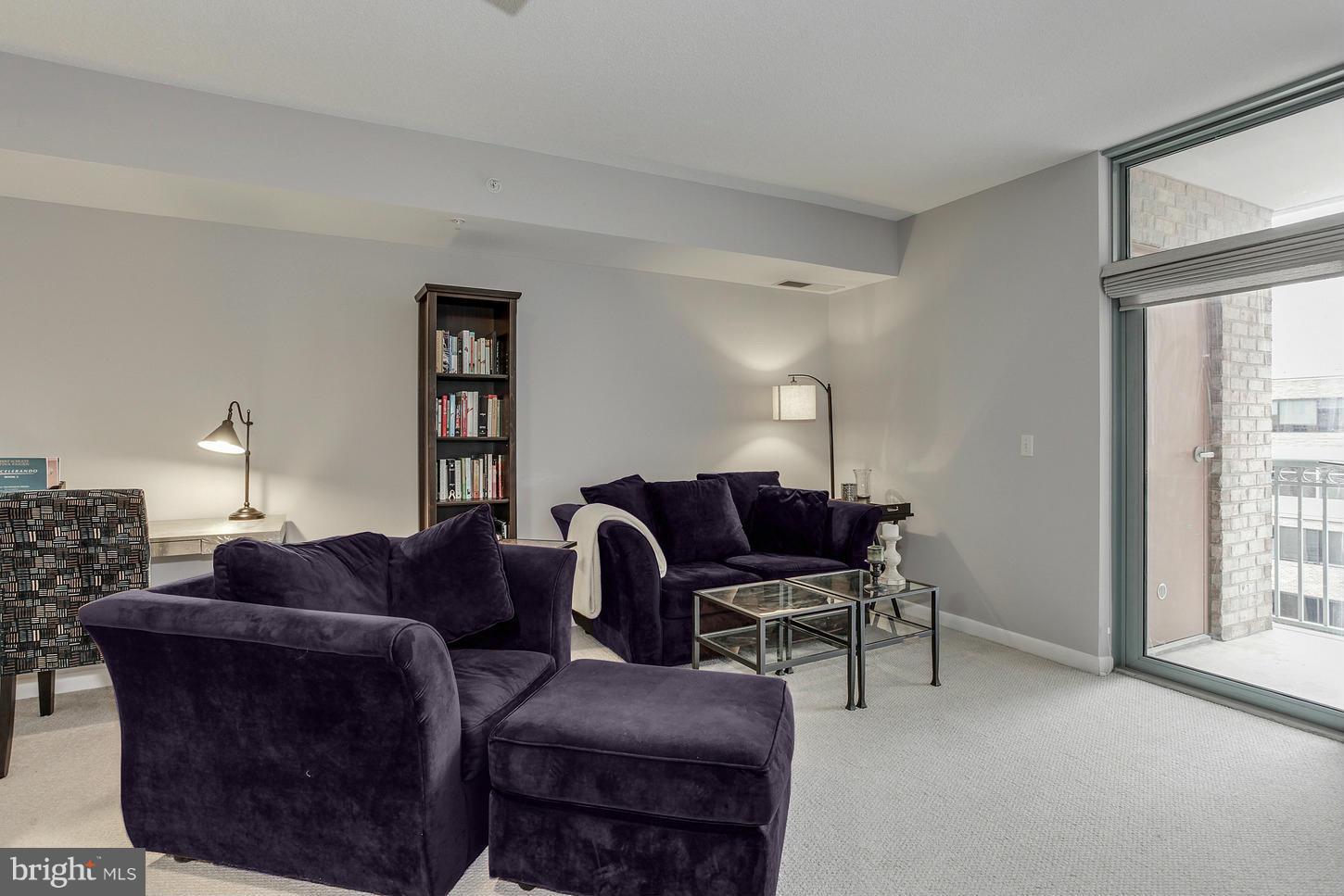 851 North Glebe Road, Unit 1010 Arlington, VA 22203 - Photo 14 of 30 a living room with furniture a ceiling fan and a window