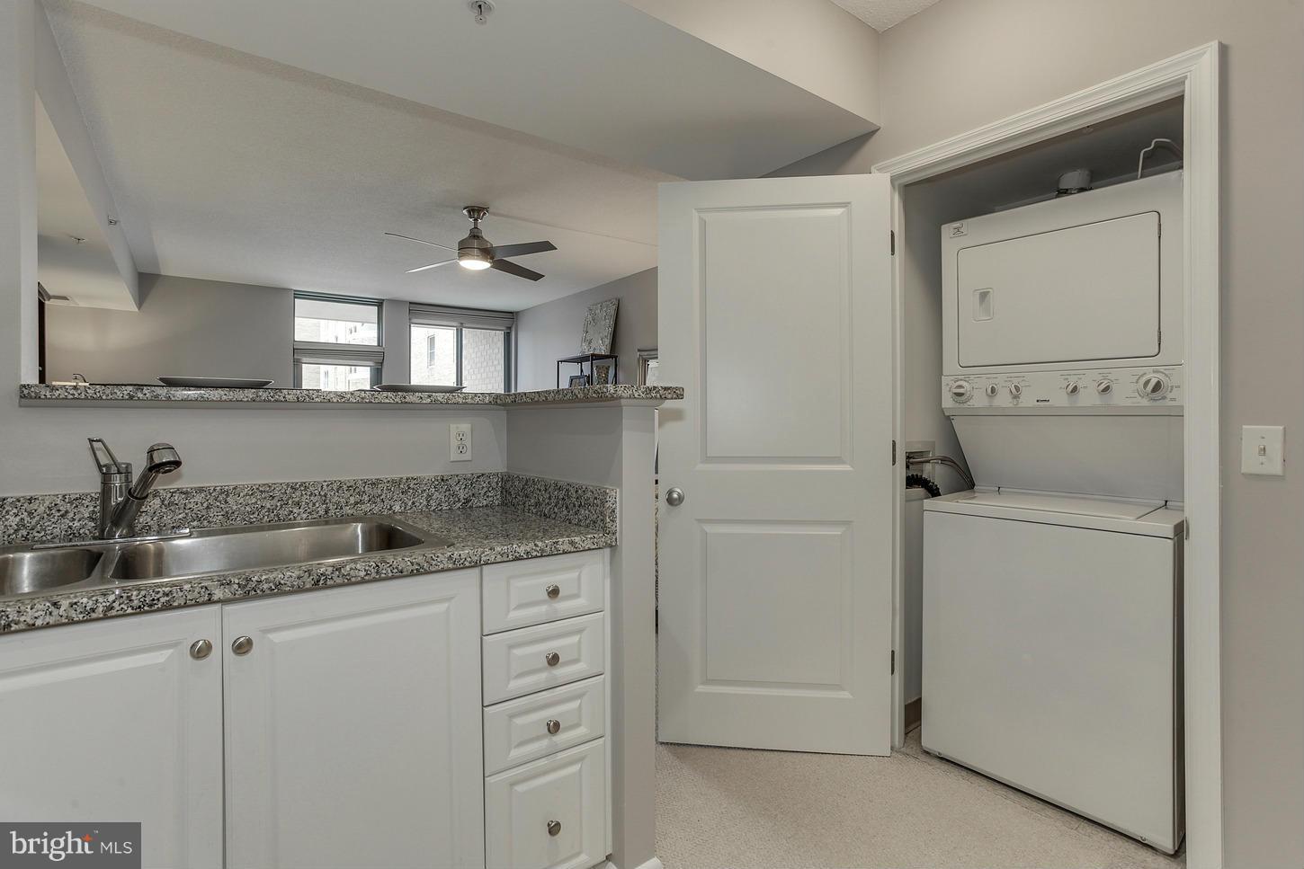 851 North Glebe Road, Unit 1010 Arlington, VA 22203 - Photo 18 of 30 a kitchen with cabinets appliances and a sink