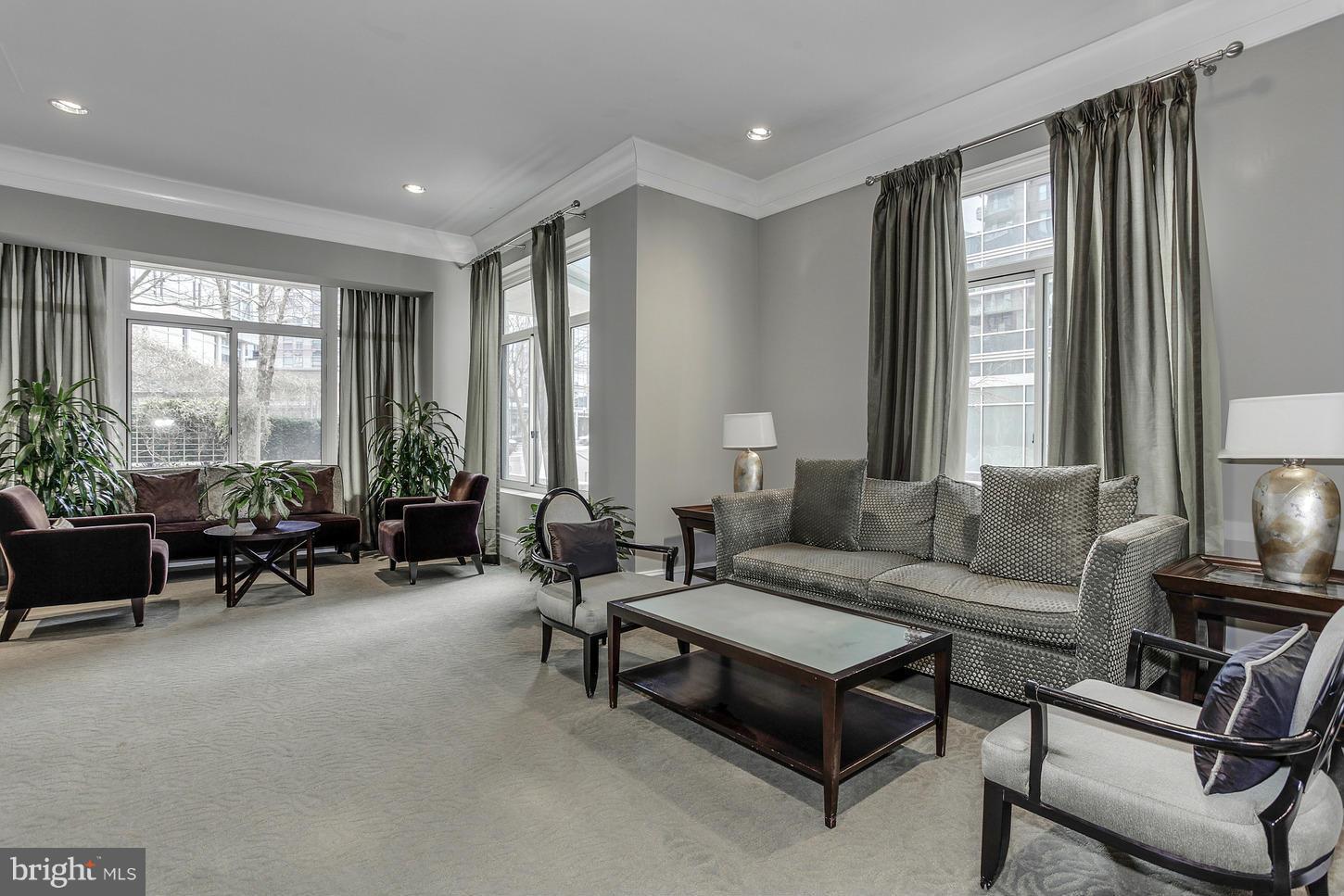 851 North Glebe Road, Unit 1010 Arlington, VA 22203 - Photo 26 of 30 a living room with furniture and a large window
