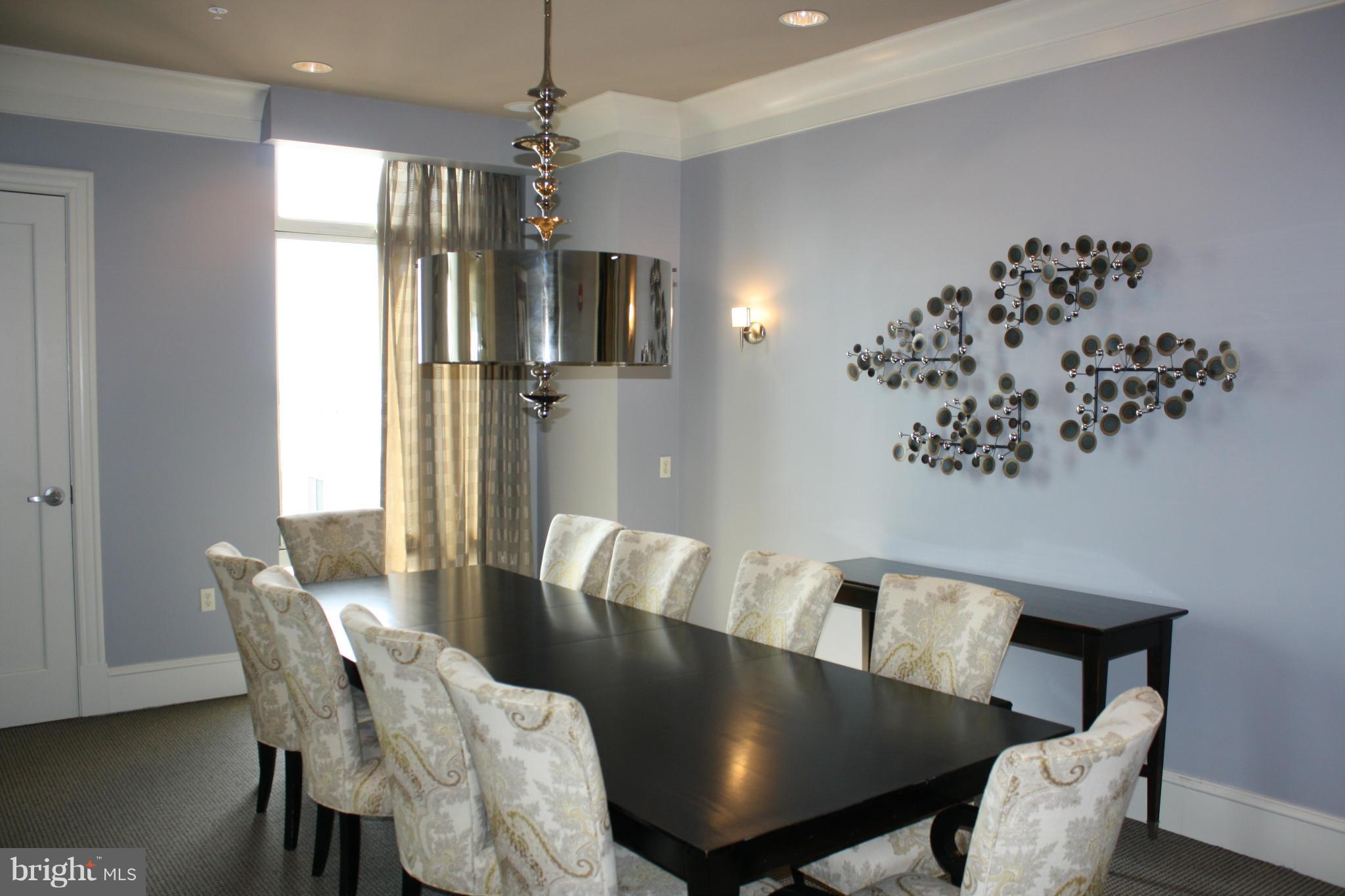 851 North Glebe Road, Unit 1010 Arlington, VA 22203 - Photo 28 of 30 a view of a dining room with furniture window and wooden floor