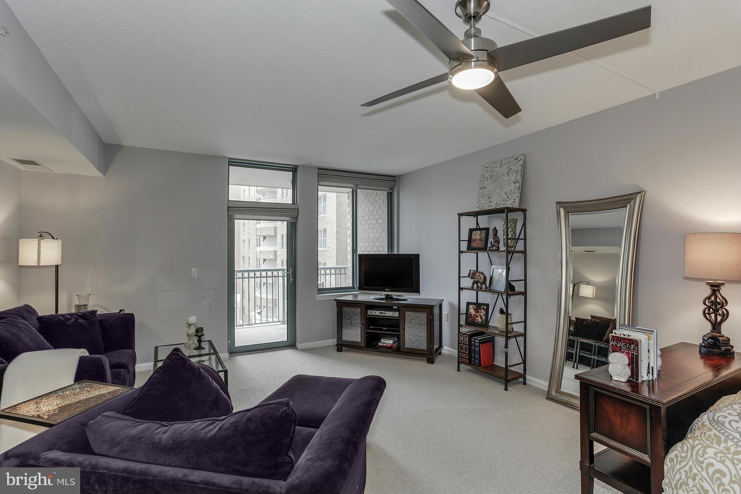 851 North Glebe Road, Unit 1010 Arlington, VA 22203 - Photo 3 of 30 a living room with furniture and a flat screen tv
