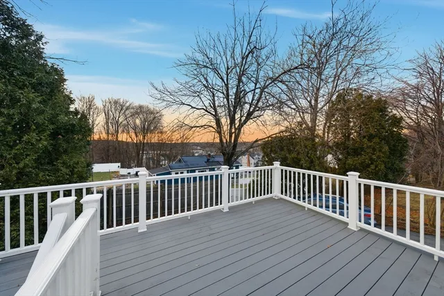 a view of deck with wooden floor and fence