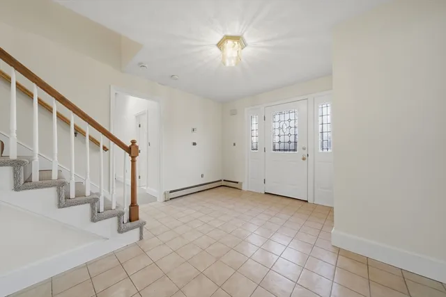 a view of an empty room with stairs