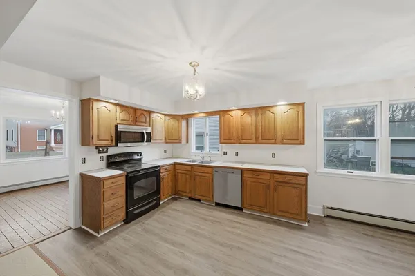 a kitchen with stainless steel appliances granite countertop a stove and a sink