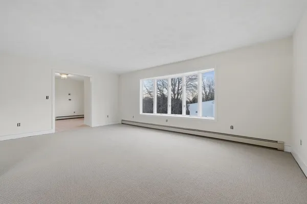 an empty room with a empty space and window