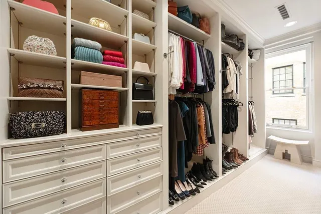 a bathroom with a tub a sink a mirror and a shower