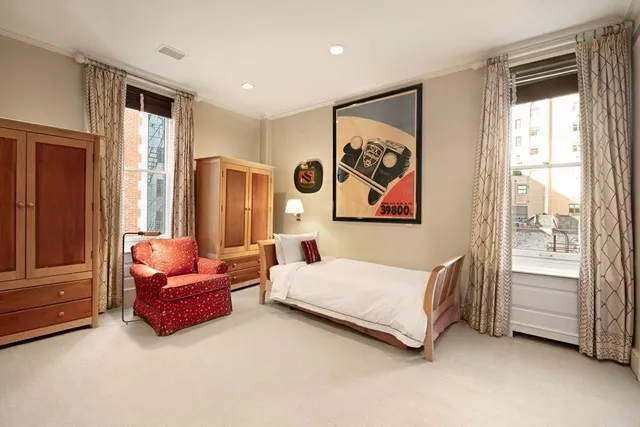 a living room with furniture and large window