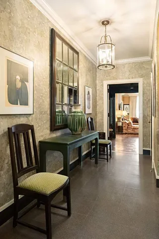 a kitchen with stainless steel appliances kitchen island granite countertop a table and chairs in it