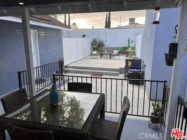 a terrace of a house with outdoor seating