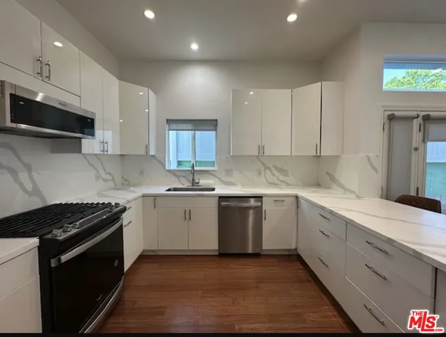 a view of bathroom with a shower and a toilet