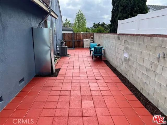 a living room with a flat screen tv and a couch