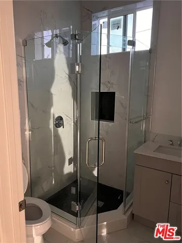 a view of a hallway with washer and dryer
