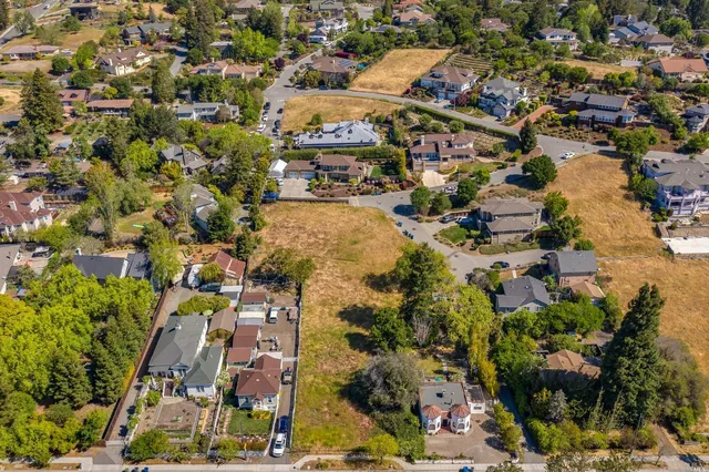 an aerial view of residential building and parking space