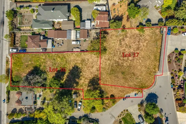 an aerial view of residential building and parking space