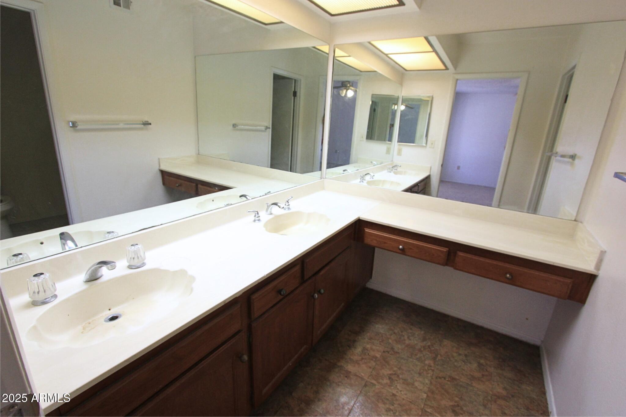 828 East Junction Street, Unit 832 Apache Junction, AZ 85119 - Photo 14 of 17 a bathroom with a sink and a mirror