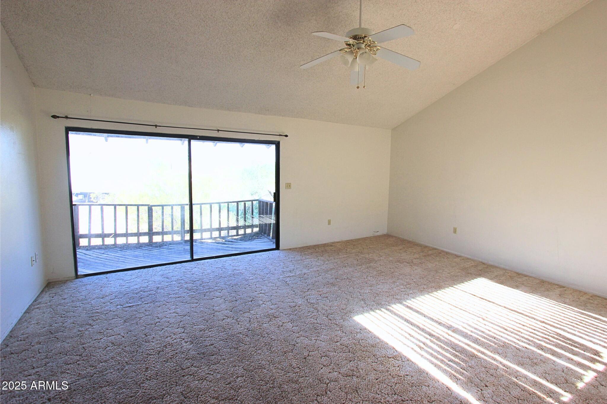 828 East Junction Street, Unit 832 Apache Junction, AZ 85119 - Photo 2 of 17 a view of an empty room with a window