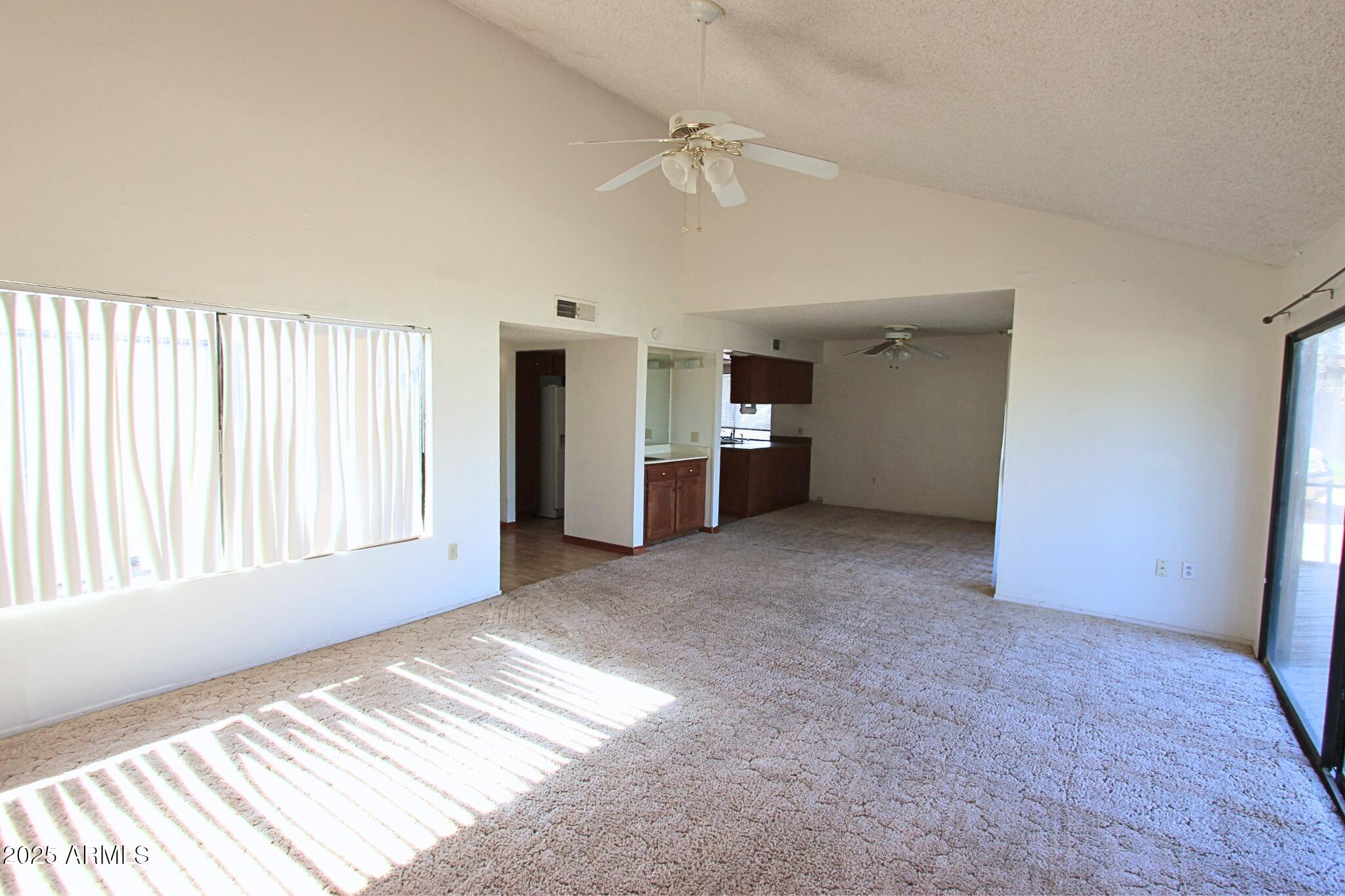 828 East Junction Street, Unit 832 Apache Junction, AZ 85119 - Photo 3 of 17 a view of an empty room with a window