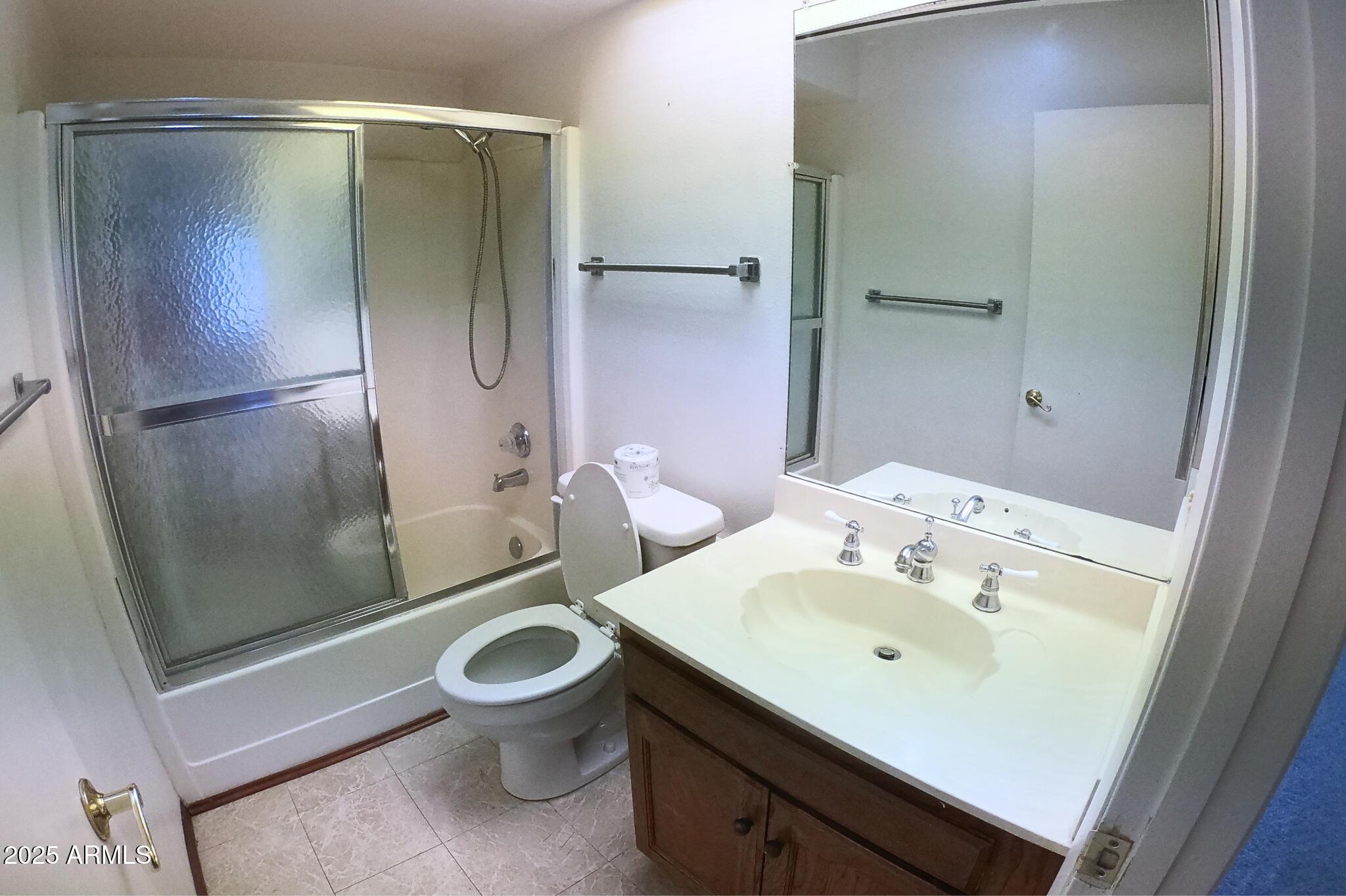 828 East Junction Street, Unit 832 Apache Junction, AZ 85119 - Photo 10 of 17 a bathroom with a sink toilet and shower